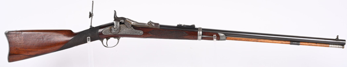 Model 1873 rifle, .45-.70 caliber, produced 1875-77 in very limited numbers by Springfield Arsenal on a special-order basis for military officers. Crisp, legible markings with 1873 model number shown on breech block, lock. Trigger guard has assembly number 69. Very fine, authentic example.