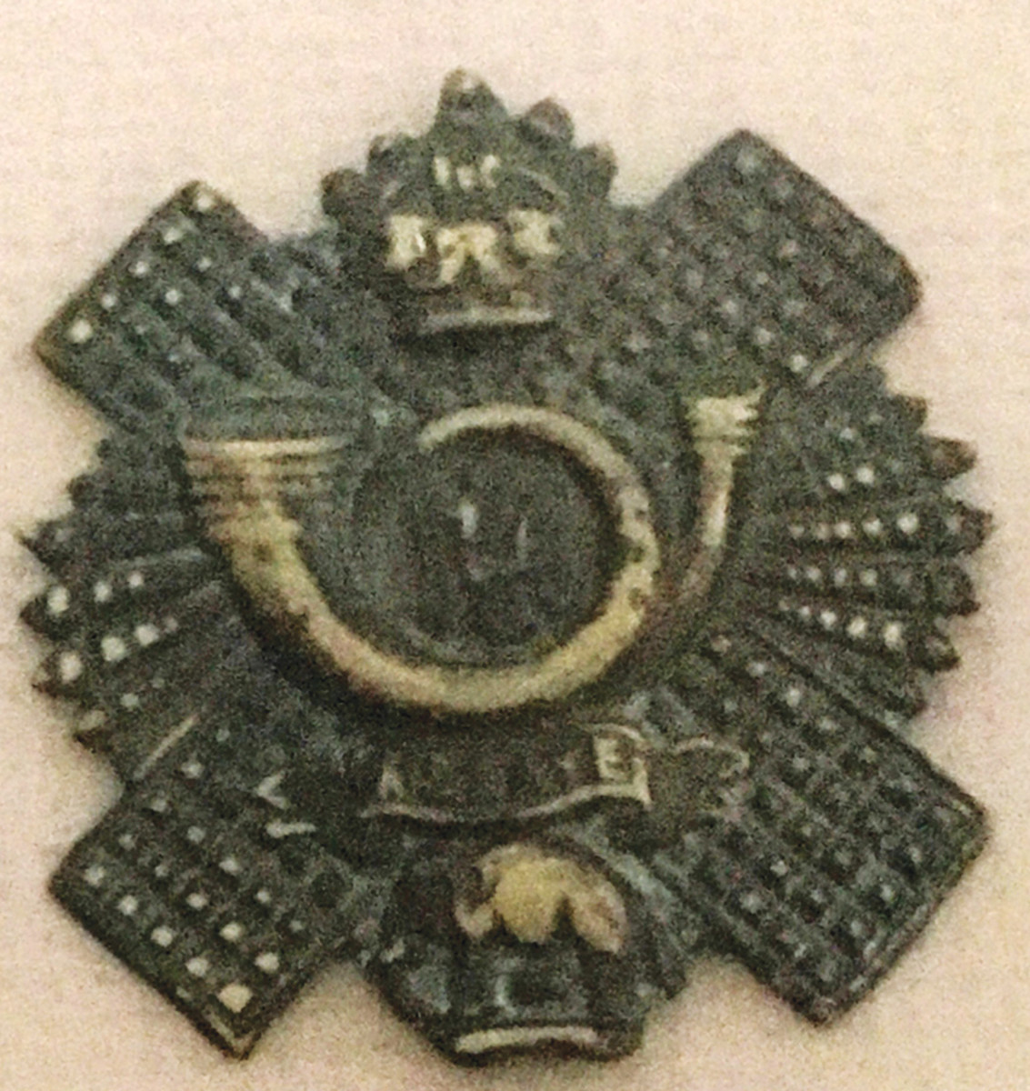 A Highland Light Infantry cap badge found in a British position.