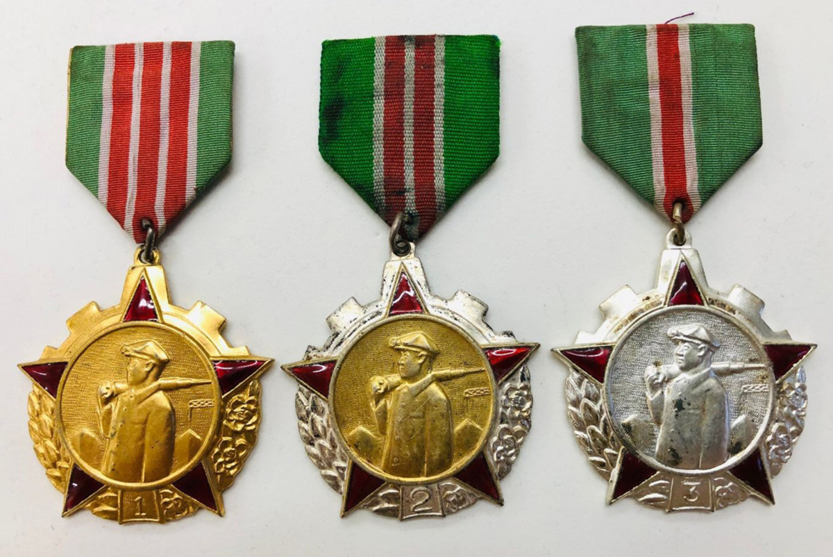 The Order of the Coal Mining Industry had three distinct classes in all gold, gold gilt center and silver for 1st, 2nd and 3rd class examples. Note the variation in respective ribbons.