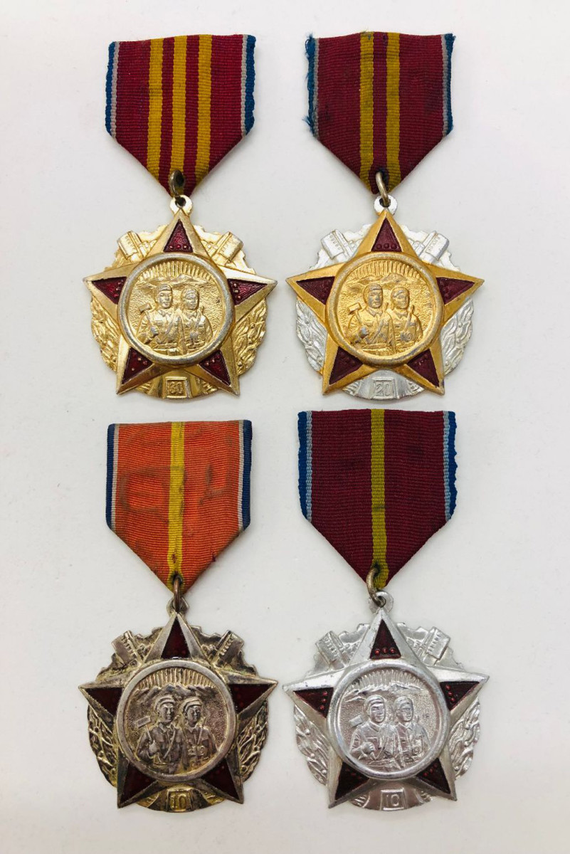 These examples of the Military Supply Service Medals illustrate a 30-year, 20-year, and two variations of a 10-year service medal.