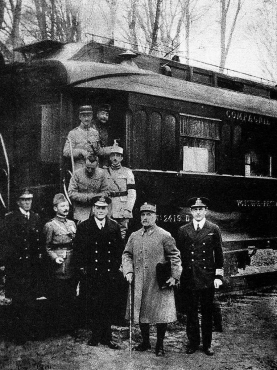 This photograph was taken in the forest of Compiègne after reaching an agreement for the armistice that ended World War I. This railcar was given to Ferdinand Foch for military use by the manufacturer, Compagnie Internationale des Wagons-Lits. Foch is second from the right.
