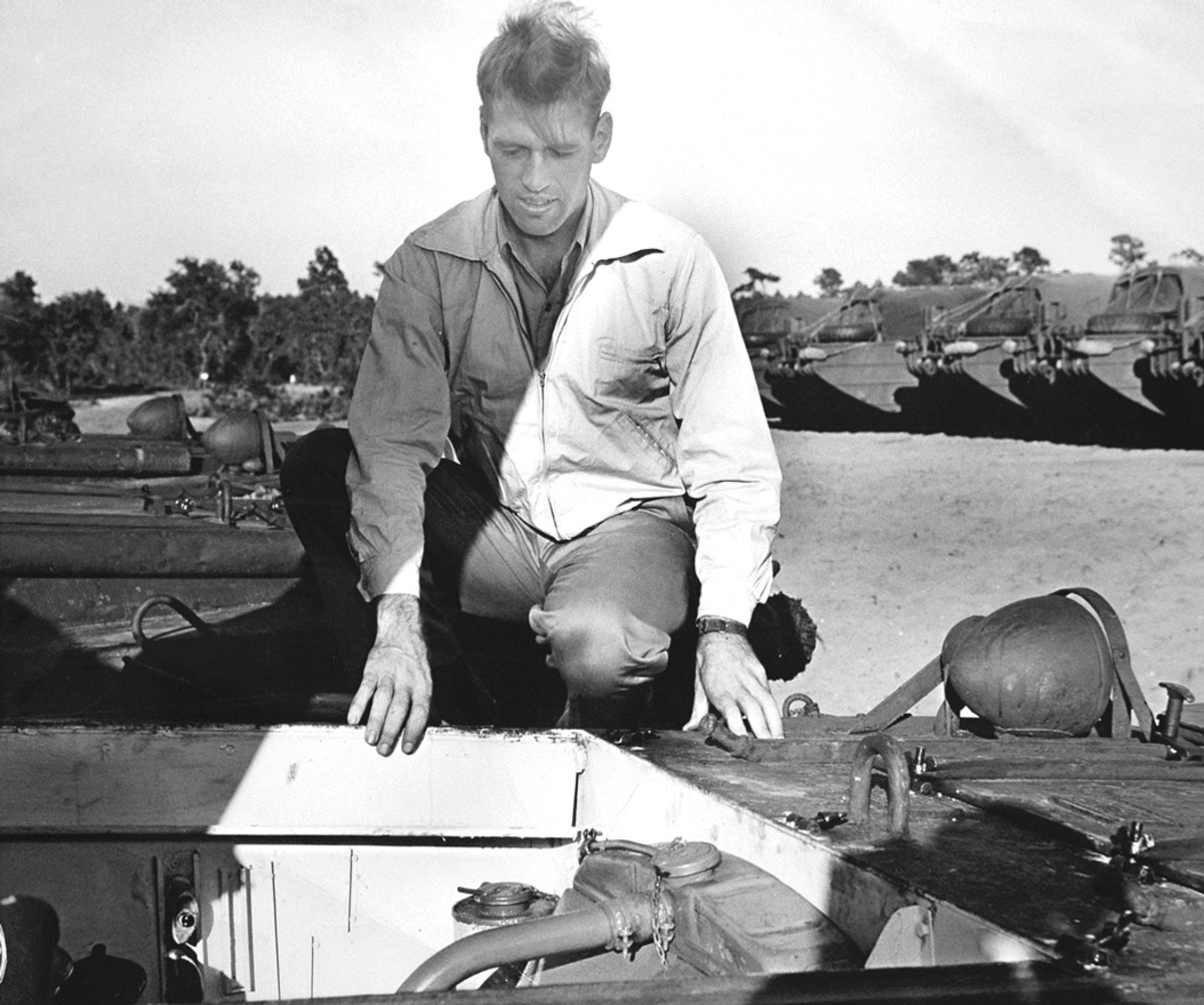 Rod Stephens, peers into the engine compartment of a DUKW, a vehicle whose hull design was largely the result of his work, along with that of fellow Sparkman & Stephens designer Gil Wyland. Such was his association with the vehicle that when he passed away on 10 January 1995, Rod left behind 100 pages of book manuscript in which he wrote concerning the DUKW: “I know more about these vehicles than anyone in the world.”
