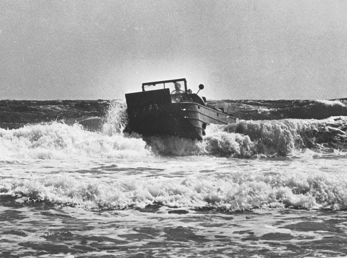 The first pilot DUKW approaches the beach at Kitty Hawk on June 24, 1942 among high waves. Procedure for coming ashore called for the driver to engage all of the wheels while still outside of the surf and to approach the shore at right angles to the waves.