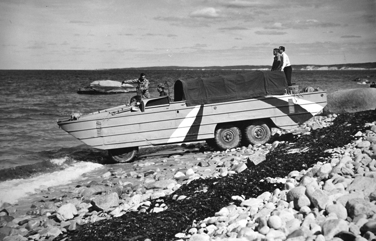 On Sept. 11, 1942 the third pilot DUKW was delivered to Camp Edwards, Massachusetts. Five days later at that base, the camouflage-painted vehicle was demonstrated to some 100 officers at Beach K, near Waquoit. The initial production vehicles closely followed the lines of this machine.