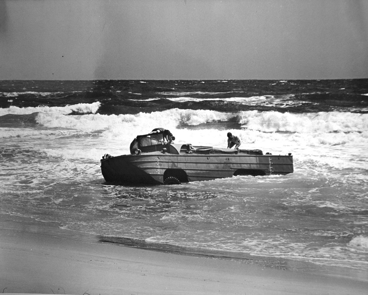 Heavy seas and current, wind, and poor left steering capability caused the DUKW to turn broadside to the waves, which swamped the driver’s compartment and doused the distributor, causing the engine to stall. The vehicle came to rest on shore in this position.