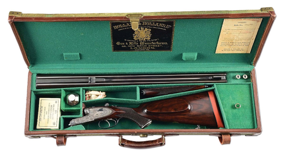 Superlative Holland & Holland Royal .375 flanged Magnum Double Rifle, circa 1910-1922 per ‘Holland & Holland: The Royal Gunmaker’ by Donald Dallas. Engraved with near-full coverage of the classic Holland & Holland Royal scroll, with vignettes for the company name. Recoil shields are embellished with bouquets of flowers and borders with rope and beadwork, and they are signed on the bottom The Royal Hammerless. Matching serial numbers and trademark on undersides of barrels. Excellent condition, mechanically fine with excellent action and stocks. VG relined case with VG accessories. Very rare gun in full-bore magnum chambering.