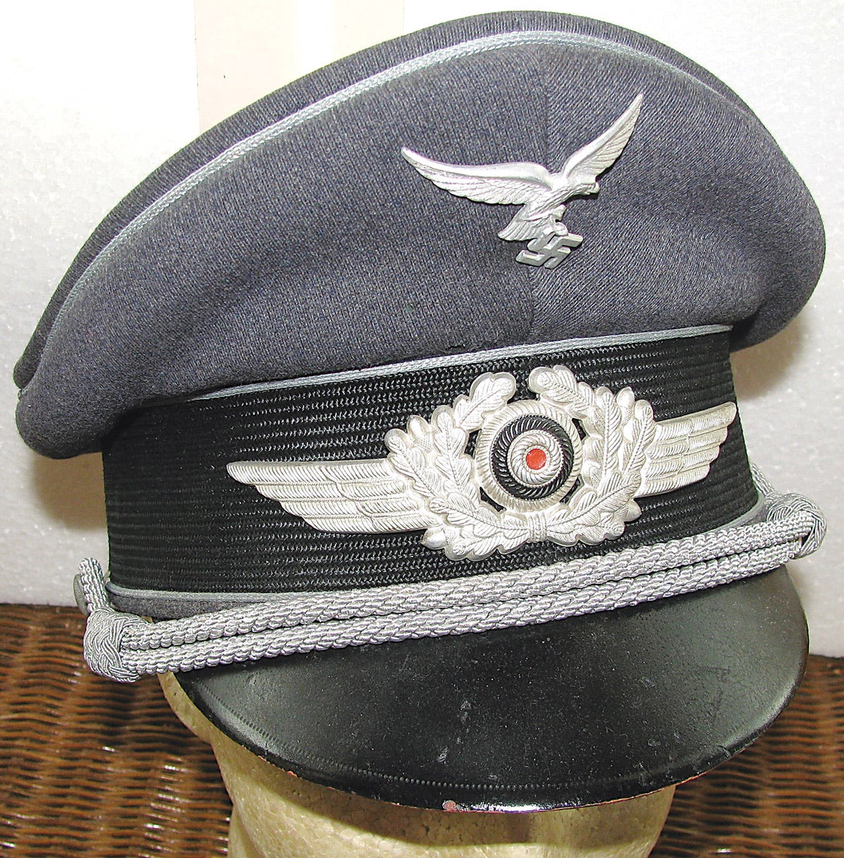A “double Erel” (The Robert Lubstein Company trademark brand marked with “Erel” in the crown and on the leather sweatband). These high-quality caps were purchased by Luftwaffe officers and saw service on all fronts. The inside of the cap is lined with synthetic silk.