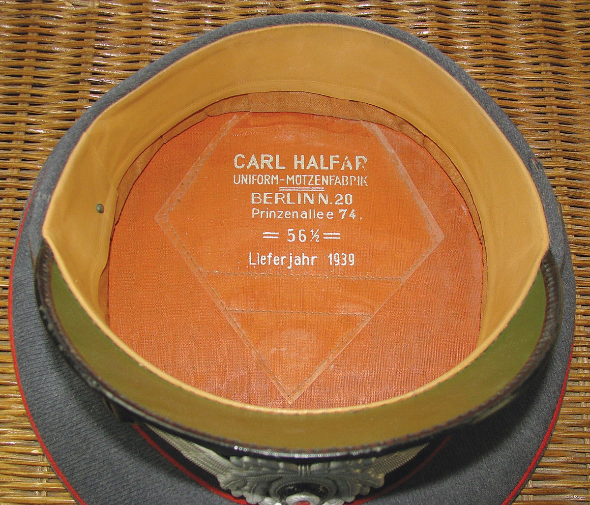 On the interior is stamped the Berlin manufacturer’s (or retailer’s) name, cap size and a 1939 year of production.