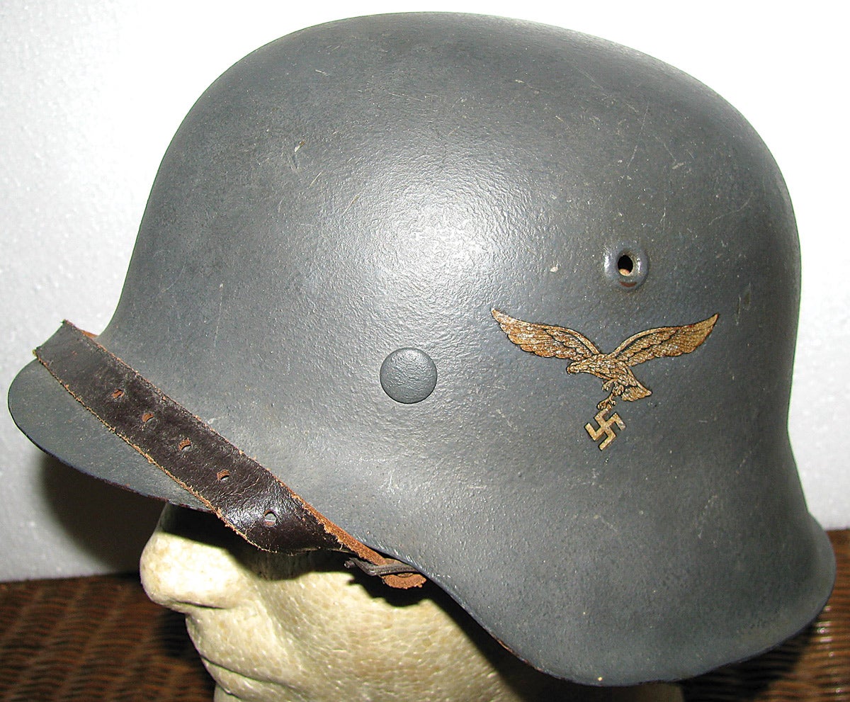 An M42 helmet with flat blue/grey paint and single Luftwaffe side decal.