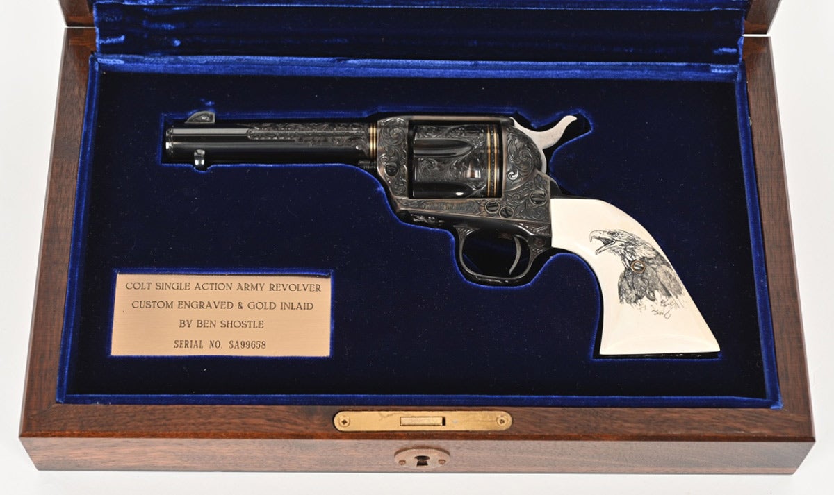 1992 Colt Single Action Army revolver, .45 caliber, engraved and signed by Master Engraver Ben Shostle. Double gold bands on barrel breech and rear of cylinder. Grips display scrimshawed American Eagle on left panel. Gold-inlaid line work and high-relief inlaid bear’s head on backstrap. Presented in deluxe French-fitted case. Sold for $9,360 against an estimate of $3,000-$5,000