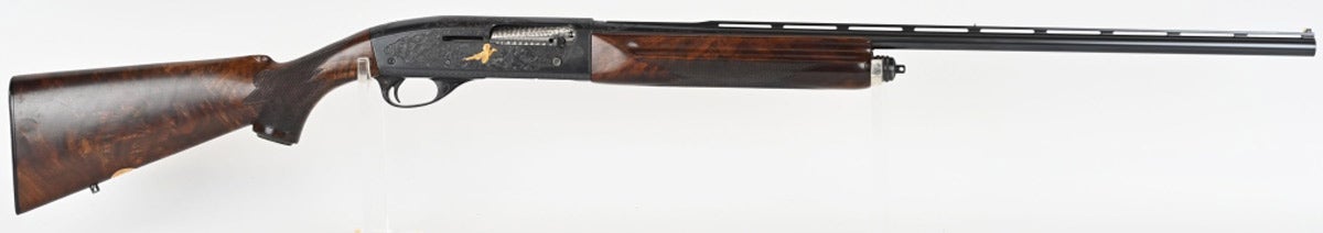 Remington 11-48 Deluxe 28-gauge semi-automatic shotgun manufactured in 1952. Panels engraved with bird and dog scenes. Top and bottom are scroll engraved and flow to top of barrel. Grade 3 walnut with checkering and factory-checkered butt plate. Inlaid brass plate reads ‘J.H. 100th Anniversary M.F. & Co. 1952.’ Sold for $9,360 against an estimate of $3,000-$4,000