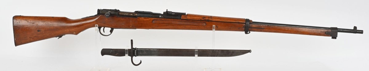 Rare Imperial Japanese Type 35 naval rifle manufactured circa 1945, significantly bearing no serial number. Made from left-over Type 35 barreled actions and Type 99 training rifle stock and sights, which the Japanese military pushed into service to support their desperate, last-ditch war effort. Believed to have been produced by Izawa under Kokua supervision. Estimated at $1,200-$1,800, this rifle sold for $4,095.