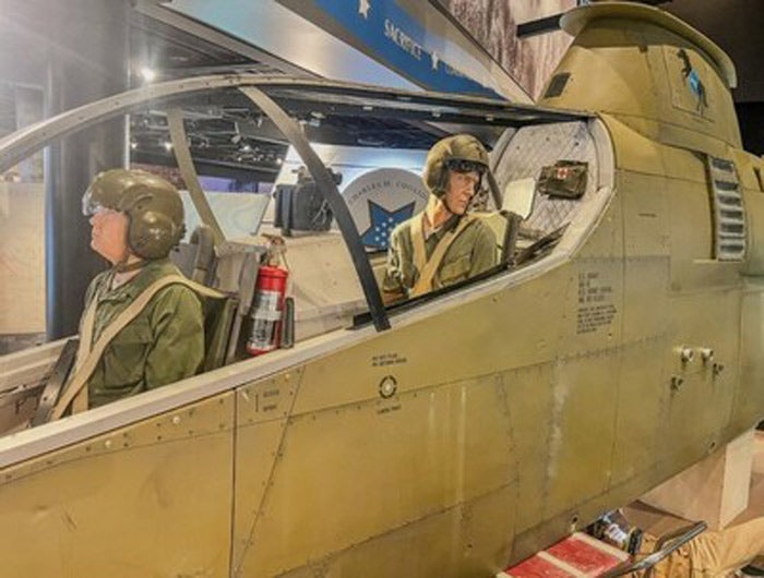 The exhibit commemorates Captain Taylor's actions on June 18, 1968, when as a First Lieutenant, he executed a daring rescue under heavy enemy fire to save a four-man Long-Range Reconnaissance Patrol (LRRP) team. With no evacuation helicopter available, Taylor landed his AH-1G Cobra—an aircraft not designed for passenger transport—allowing the stranded men to cling to the helicopter's skids as he flew them to safety.
