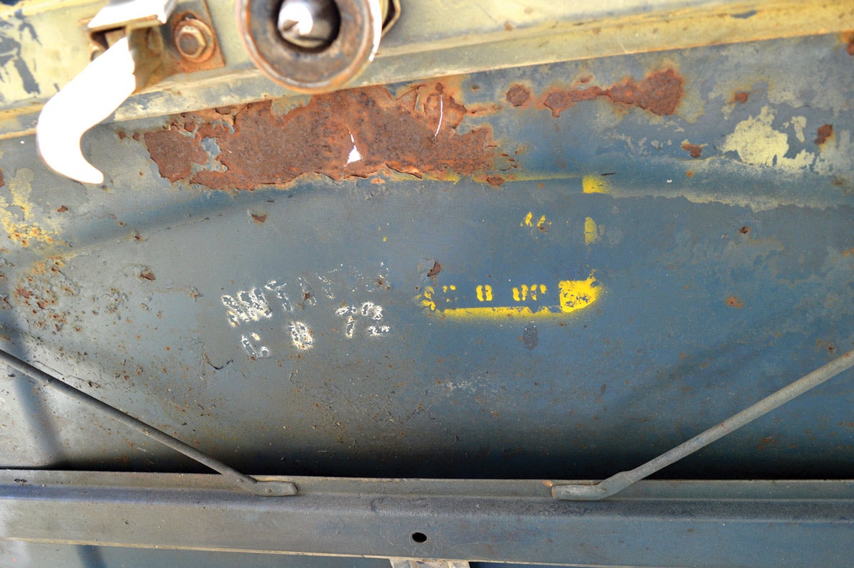 Blue paint and stencils from the Bronco’s military days can be found throughout, including under the hood.