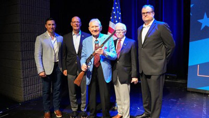 MOH recipient, Maj. Gen. James Livingston, USMC (Ret.) with the Spirit of the Corps 250th Anniversary Tribute Edition rifle.