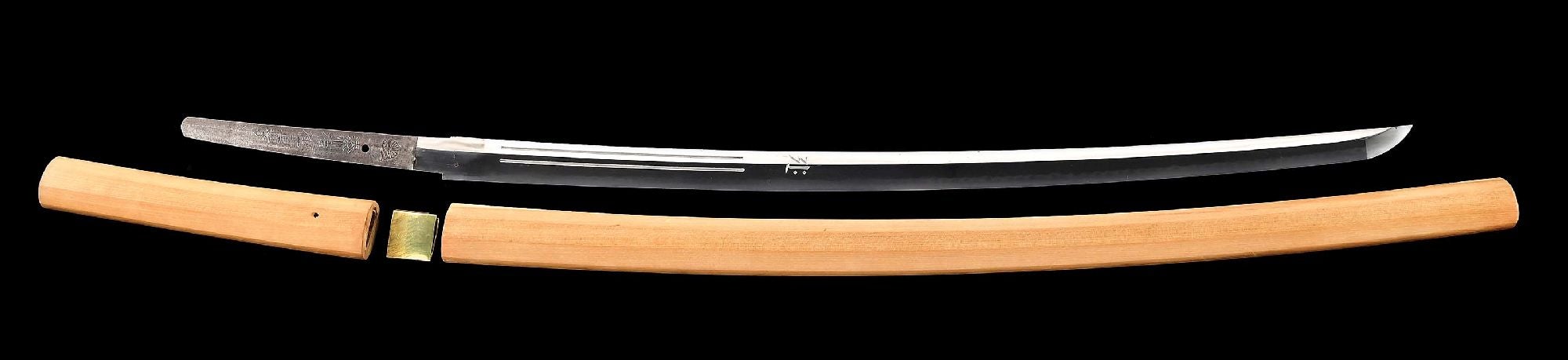 Historically important World War II sword forged by Masataka (Japan) at the Minatogawa shrine and signed ‘(Kikusui mon) Minatogawa Jinja Masataka,’ dated the 4th month during the 17th year of Showa (April 1942), and, critically, signed ‘Igo Kancho Tanabe Yahachi Chusa,’ which translates to ‘I-Class Captain Lieutenant Commander Yahachi Tanabe.’ Date and rank suggest the sword was with Tanabe when he sank the USS Yorktown aircraft carrier at the Battle of Midway, June 1942. Length: 39½in. Sold for $49,200 against an estimate of $18,000-$25,000