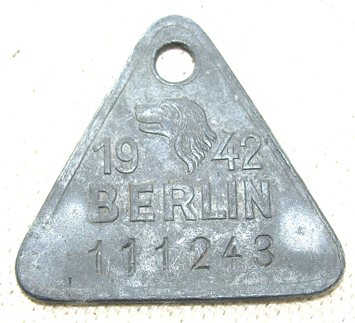 A 1942 dog license from Berlin. Earlier such lowly identification tags had led German soldiers to nickname the id disks they wore as “Hundenmarken” (dog tags).