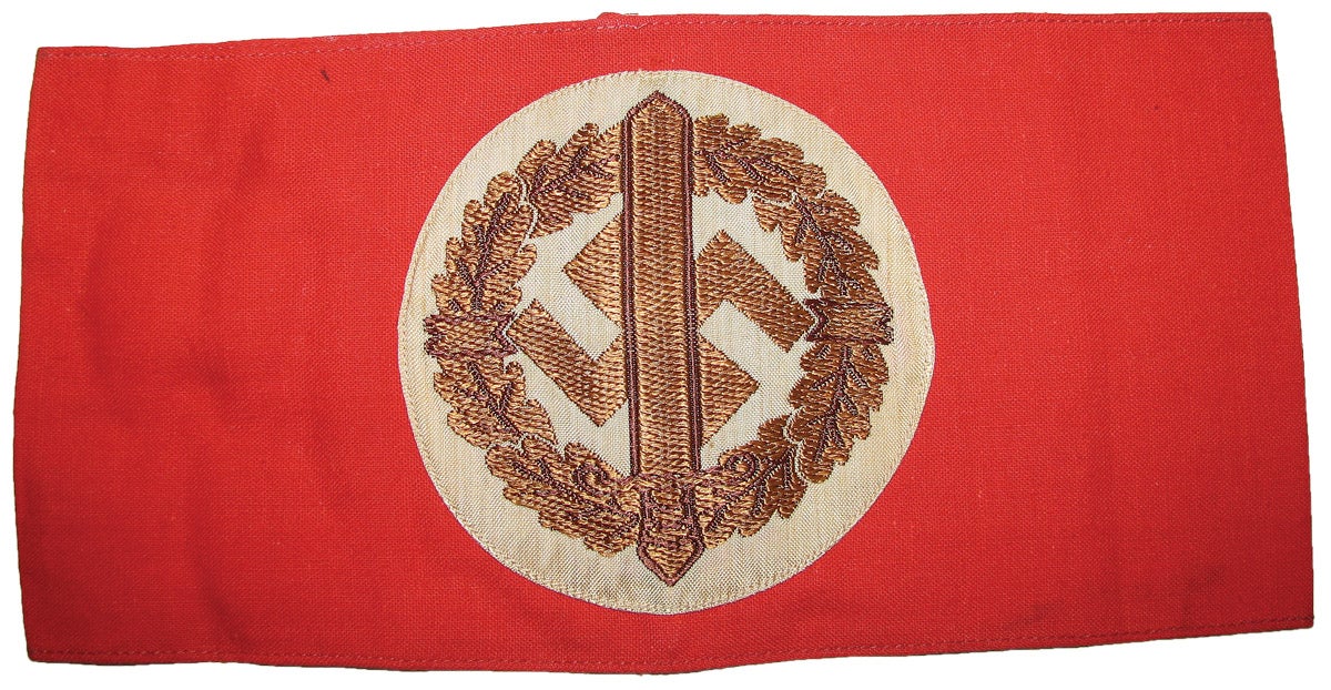 A Wehrmannschaft armband, used on uniforms until 1942, after which it was authorized for civilian clothing worn by the SA-Wehrmannshaft members.