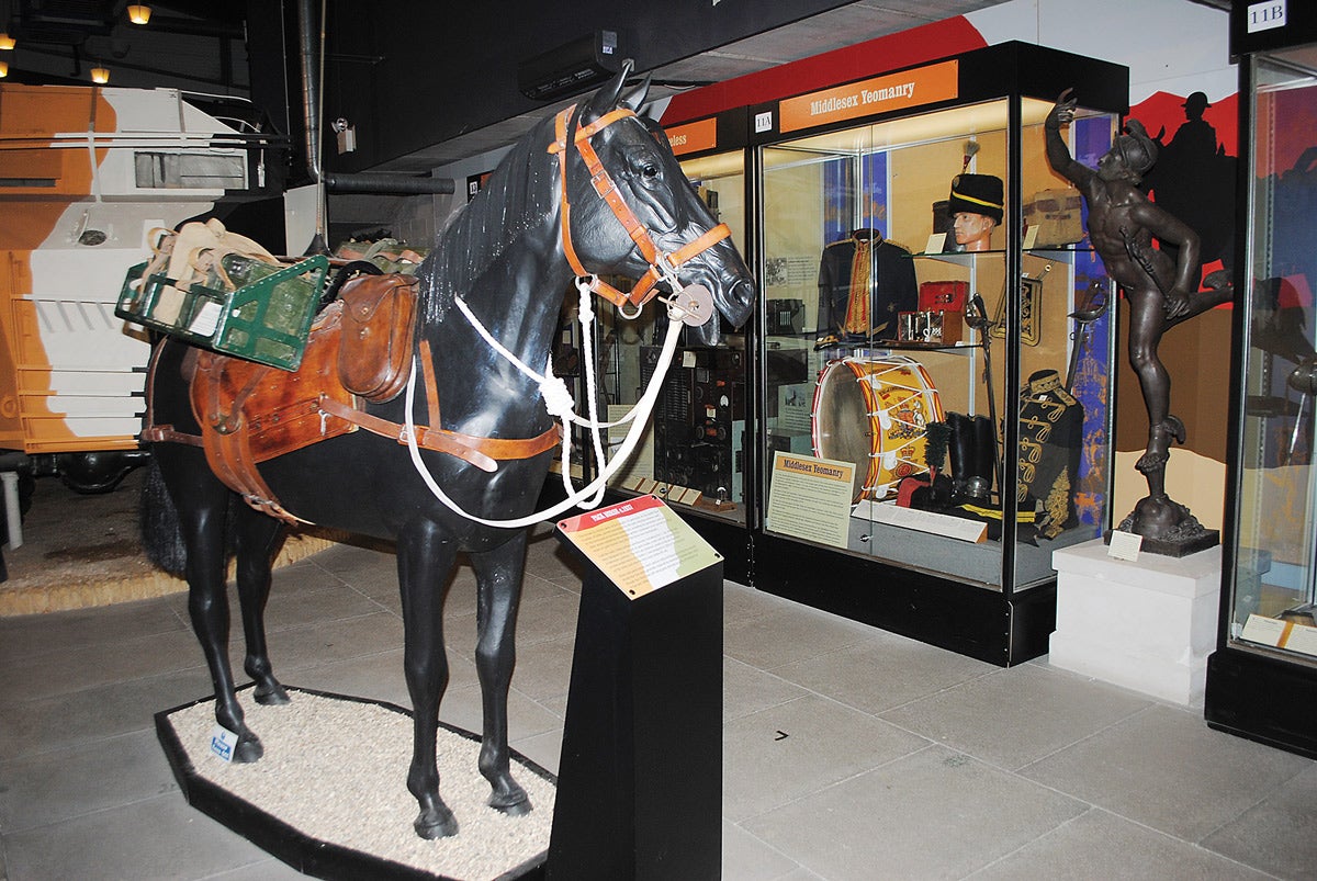 One of the life-sized displays at the Signals Museum is stationed in front of some wonderful display cabinets.
