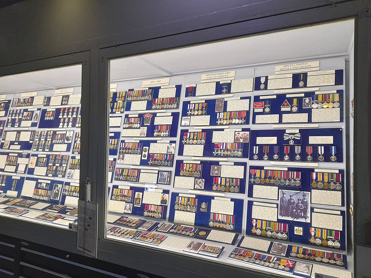 Medal collectors enjoy the awards gallery at the Keep Museum in Dorchester.