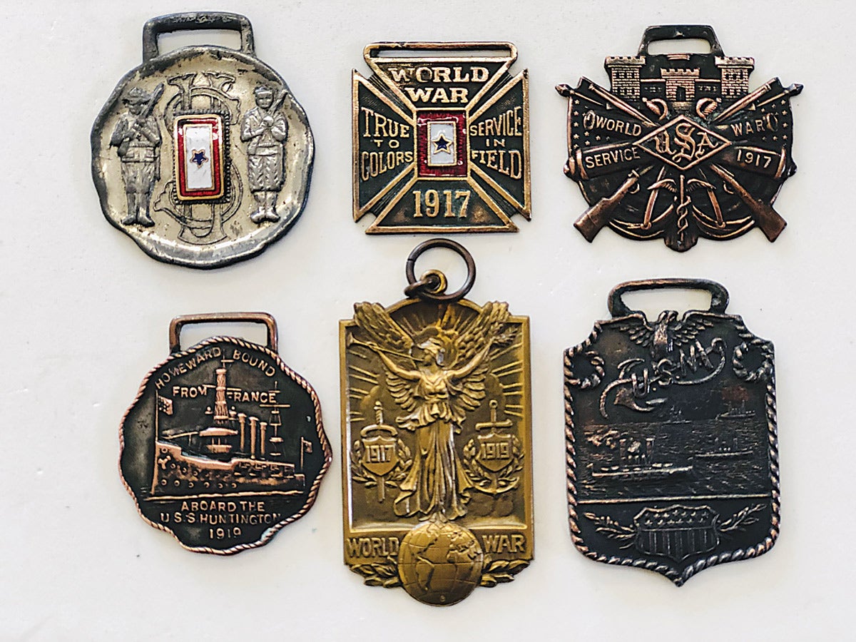 Examples of WWI medals or fobs associated with Army, Navy & Engineers service available to collectors.