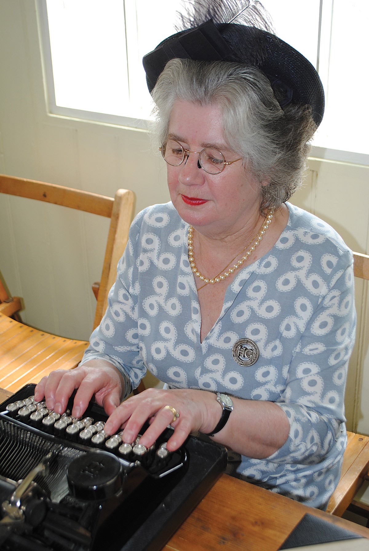Female members of the Home Guard were allocated for administration duties, as shown by this re-enactors who is also wearing an original badge to indicate her role.