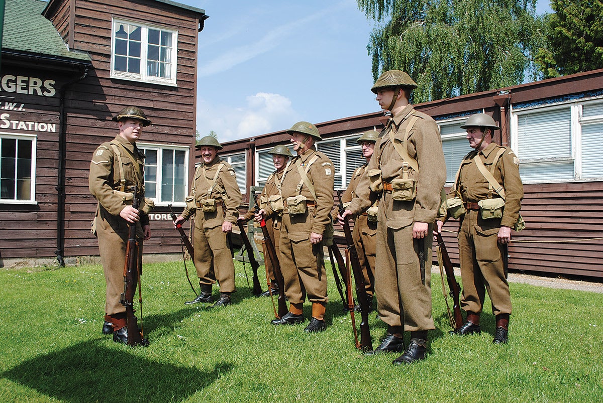 A re-enactor showing how the Home Guard later became transformed with the issue of woollen battle dress uniform, P17 rifles with red non-standard identification band. He is also wearing leather anklets.