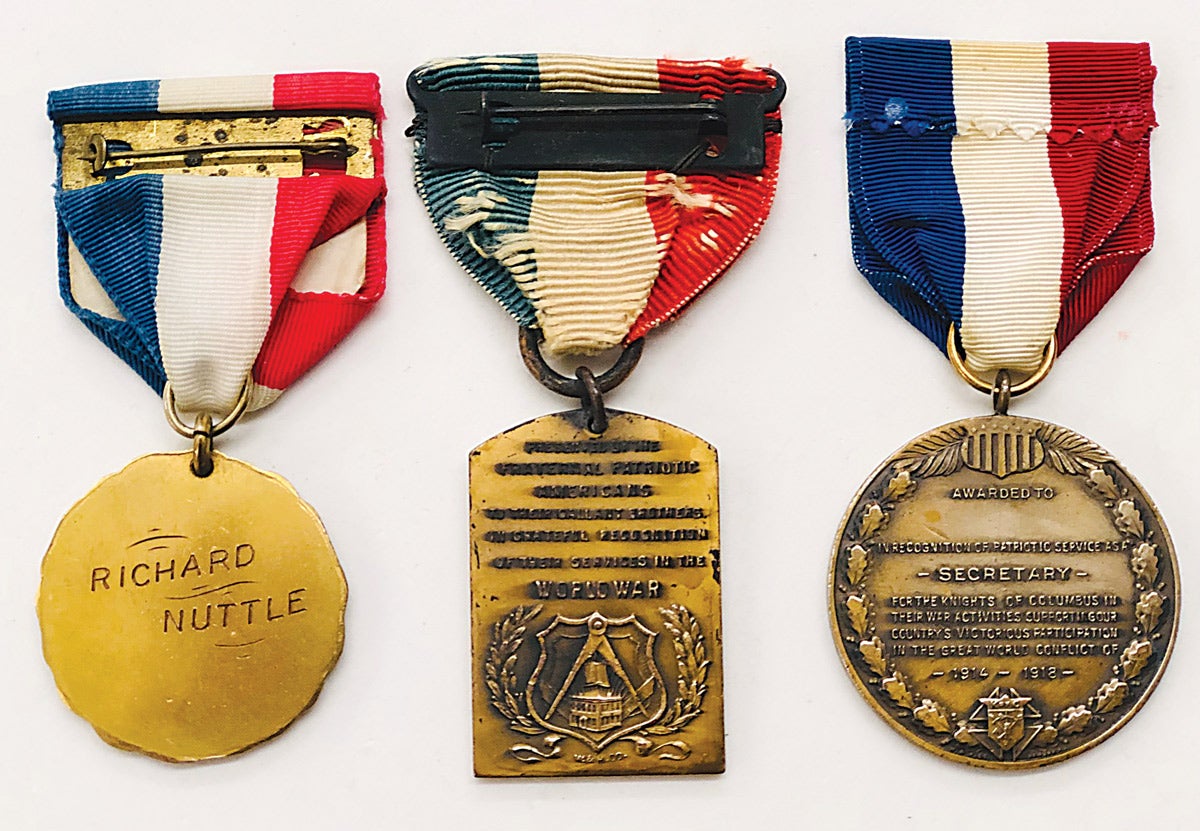 The O of IA reverse is named to a particular recipient. The Fraternal Patriotic Americans was made by Whitehead & Hoag Company with a design used by two additional organizations. The Knights of Columbus medal shows a Whitehead & Hoag maker mark and is unique.