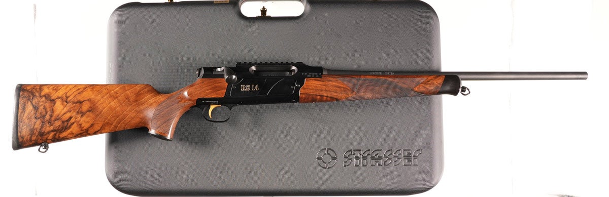 Strasser Evolution RS 14 sporting bolt-action rifle chambered for 6.5 Creedmoor. Serial No. 1A0043. Takedown with blue finish and highly figured and marbled oil-finished walnut stocks. Single-set trigger, straight pull design with detachable magazine. Excellent with no indication of use. Mechanically excellent 20in barrel. Factory takedown luggage case.