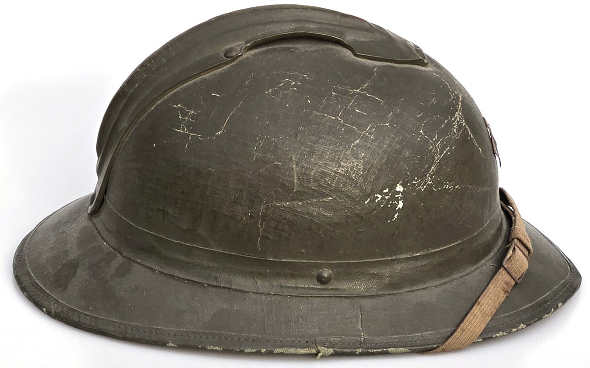 These would have offered little ballistic protection. As the first pattern fiber helmet, it could be mistaken for a French Model 1915 steel helmet.