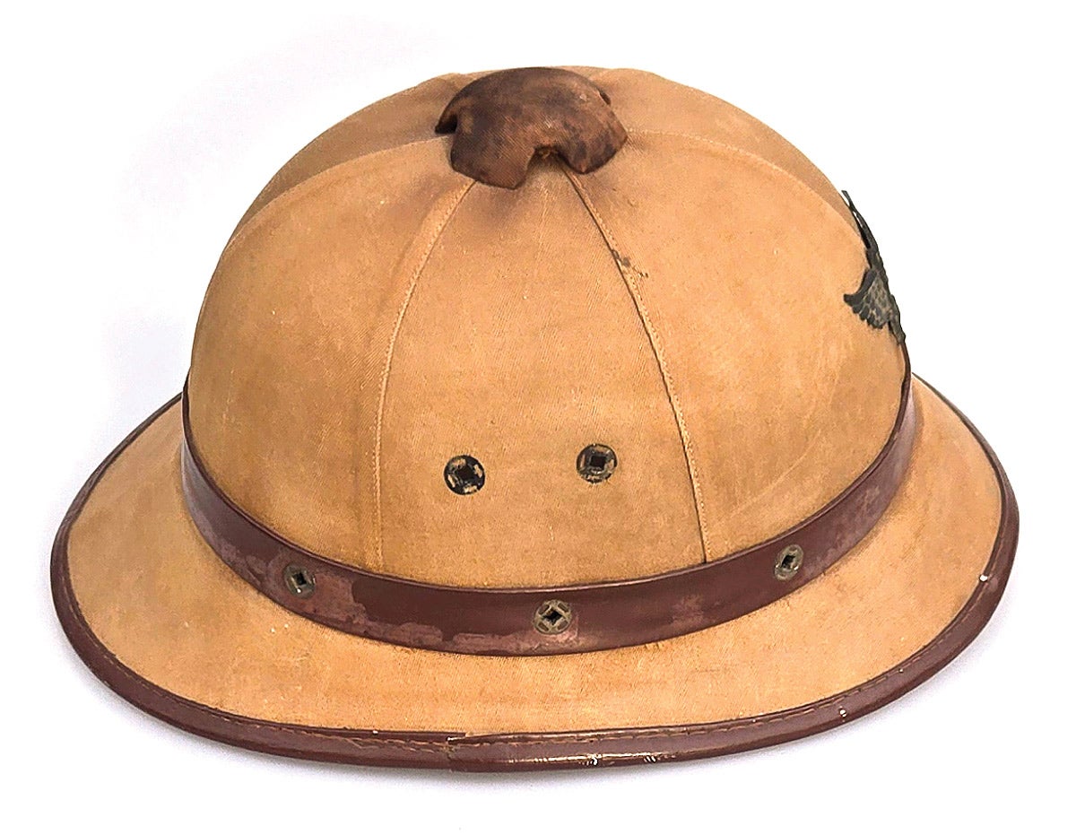 . It is possible that the steel helmets copied the vent caps used on the European sun helmets of the era.