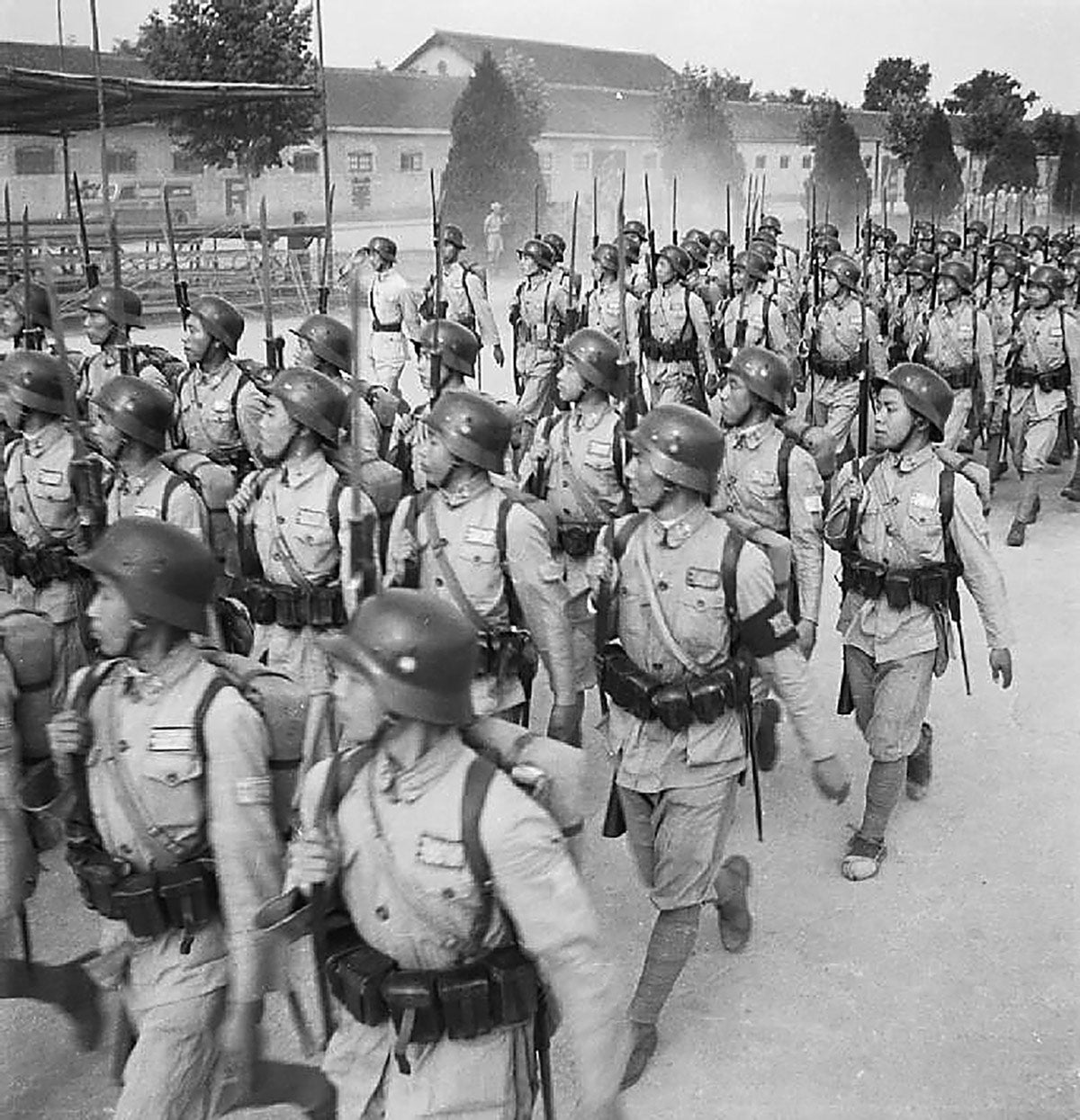 NRA troops in marching drills at the Chinese Military Academy in Chengtu in 1944, highlighting that even late in World War II, the German M35 helmet was still in use