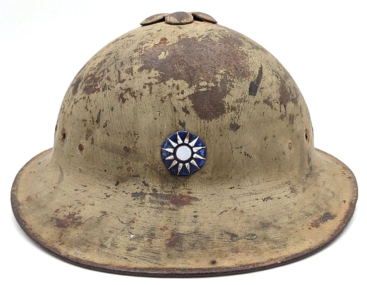 An extremely rare example of a Chinese Model 1922 “Plum Blossom” helmet.