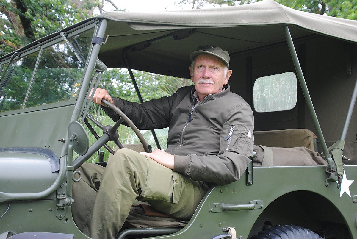 Roy Gallina at the wheel of his Ford jeep