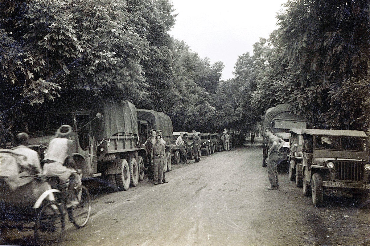 In early August of 1945 the U.S, Navy in conjunction with The Sino-American Cooperative Organization (SACO) sent a truck convoy carrying food, fuel and military supplies from Calcutta, India to Chungking, China over the Burma Road. According to a veteran who drove in that convoy, the vehicles were mainly “six-by-sixes (GMC CCKWs) and jeeps.” Note “U.S. Navy” on the front bumper of the jeep on the right.