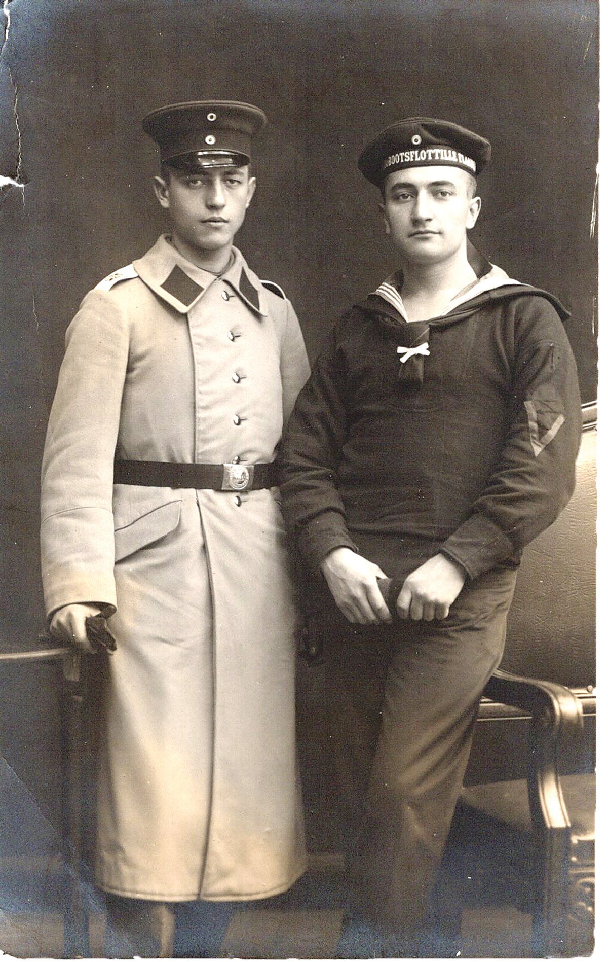 A Kaiserliche Marine “Matrose” (seaman) poses with his brother, a soldier in the Imperial German Army.
