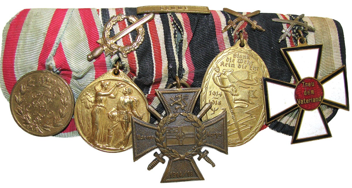 The longer bar has a Flanders cross hanging in the center position.