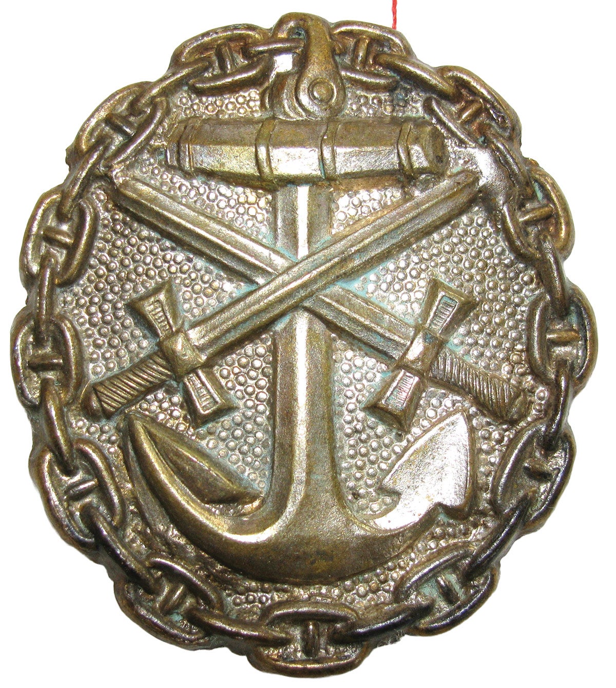 A silver WWI “Verwundetenabzeichen” (naval wound badge) awarded for three to four wounds.