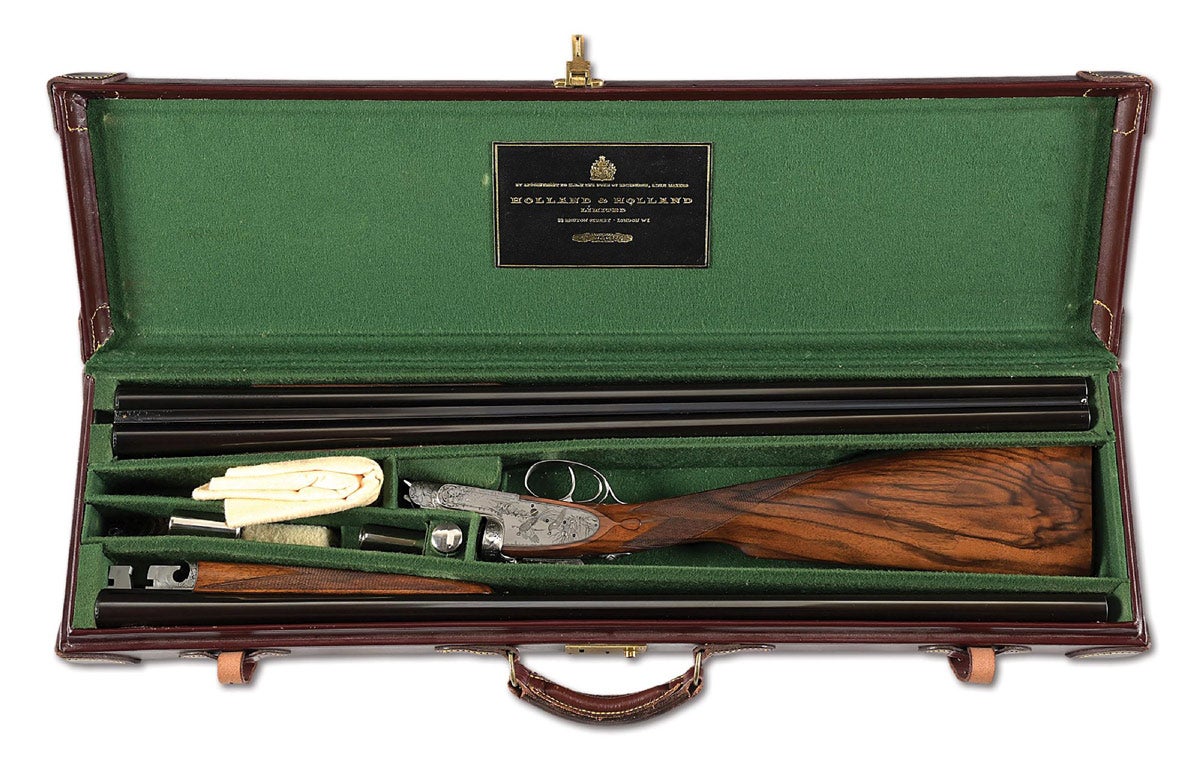 Cased Geoffrey Casbard-engraved Holland & Holland 12 gauge Royal Model Deluxe self-opener ejector side-by-side shotgun with two sets of 28in barrels. Serial number on the bottom strap, maker’s name on the bottom of the action on both sides. Barrels marked with Holland’s ‘33, BRUTON STREET, LONDON’ address. Engraved by Geoffrey Casbard, whose initials are concealed within vignettes. Ex collection of noted African hunter and collector Richard Cousins.