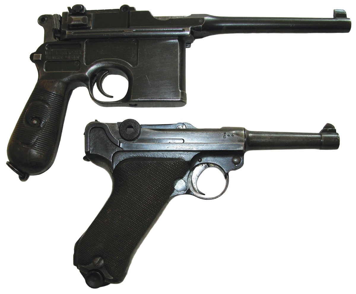 A red-nine Mauser C-96 “broomhandle” and PO8 luger, both which were used by the Kaiserliche Marine in their WW1 service.