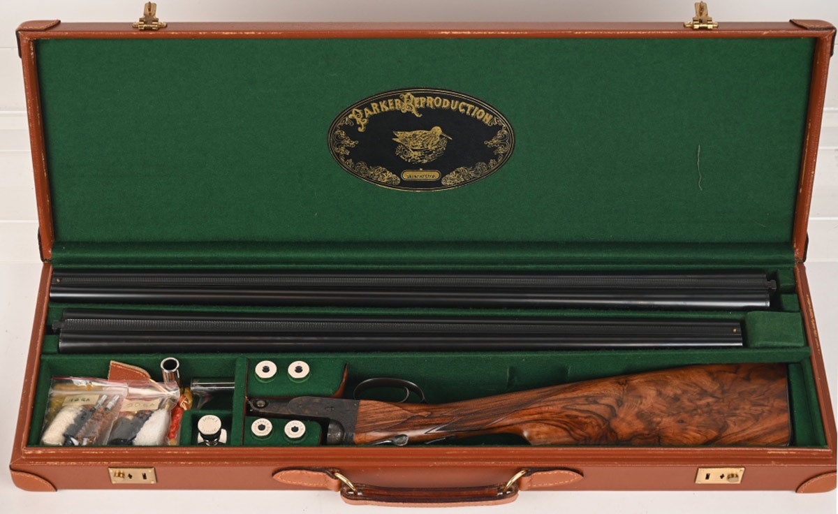 Circa-1987 Winchester 16-gauge reproduction DHE two-barrel side-by-side shotgun set from the incomparable Parker Reproductions series, in as-new condition with mechanics identical to the original Parkers. Chokes: Q2 left and Q1 right. Blued rib barrels were made in Japan by Olin-Kodensha and imported under Winchester's import license and bear that mark on the barrels. Comes with two 16-gauge Parker Reproductions nickel-finished snap caps, four 16-gauge unbranded nickel-finished snap caps, Parker Reproductions nickel-finished oil container, 20- and 16-gauge swabs and brush, cleaning rod and keys, and factory literature, manual, and correspondence with factory.