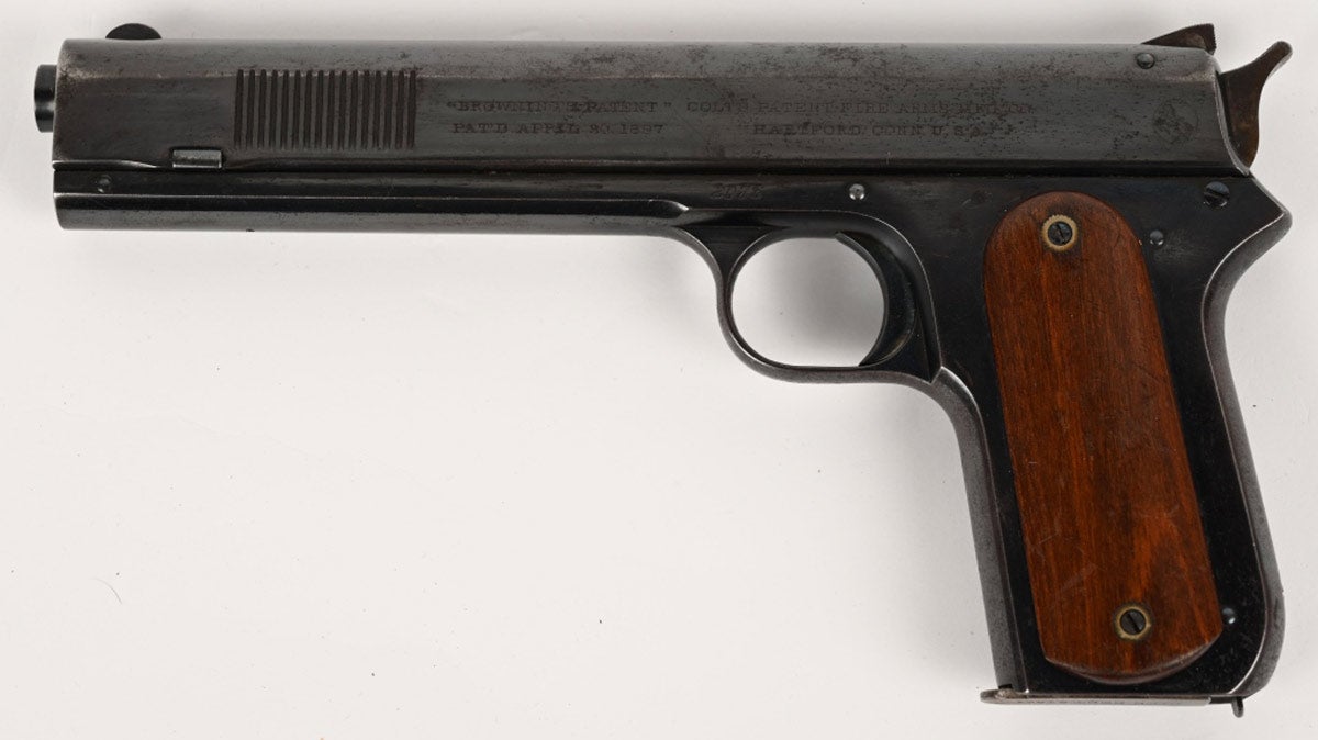Colt Model 1900 .38 ACP rimless pistol, manufactured 1902 and an example of the first of a long line of John Browning-designed semi-automatic pistols that were both licensed and manufactured by Colt’s Patent Fire Arms Manufacturing Company in Hartford, Connecticut. Some collectors refer to the Model 1900 as the “Colt Paterson of semi-automatic pistols.” Metal retains 90% finish with bright bore and very strong rifling. Excellent grips. Original magazine