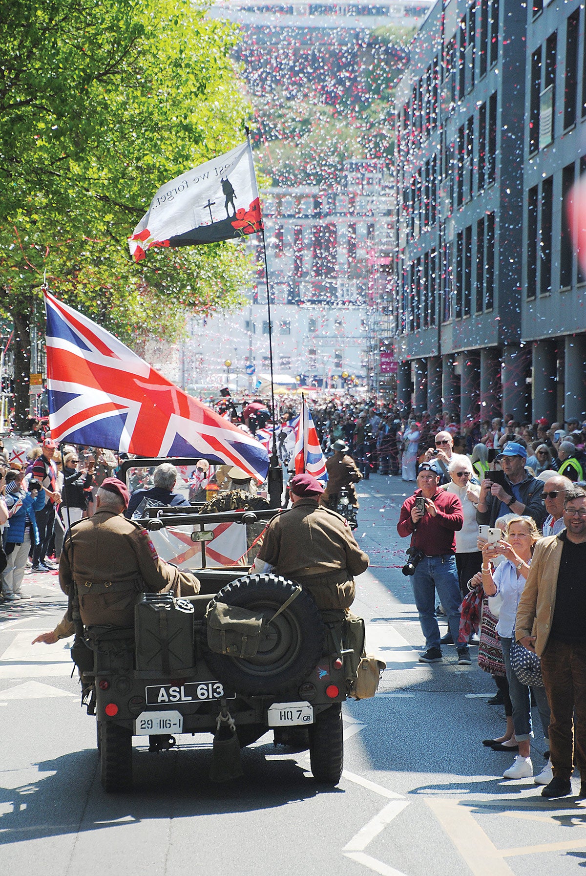 The column of vehicles approached Liberation Square and all the waiting crowds celebrating the occasion.