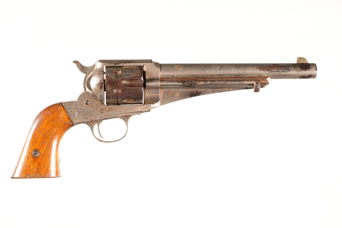 Remington 1875 Revolver, .44 caliber, Serial Number 197, manufactured in 1875. A competitor to the Colt SAA, notable for its sturdy frame. An 1875 is known to have been used by bank robber Frank James. Auction example is a nice, early gun with nickel 7½” barrel, bright bore with light to moderate pitting and excellent hammer notches. Spring for cylinder locking bolt is broken. Provenance: Mike Stewart Collection. ATF Form 4473 not required.