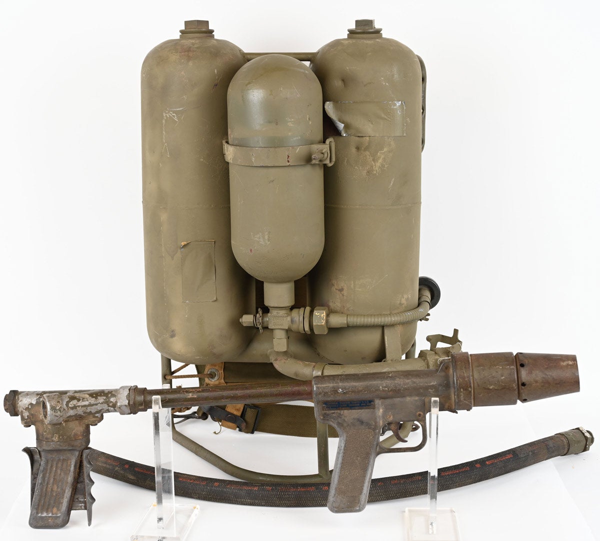 Inert World War II US M2 backpack flamethrower with tanks and wand; man-portable and of a type that saw combat use in the Pacific theater, deployed to combat strongly fortified and entrenched Japanese positions. Following the success of the M1 flamethrower, the M2 was developed and put into combat use in 1943. Over time, the majority of M2s were scrapped.