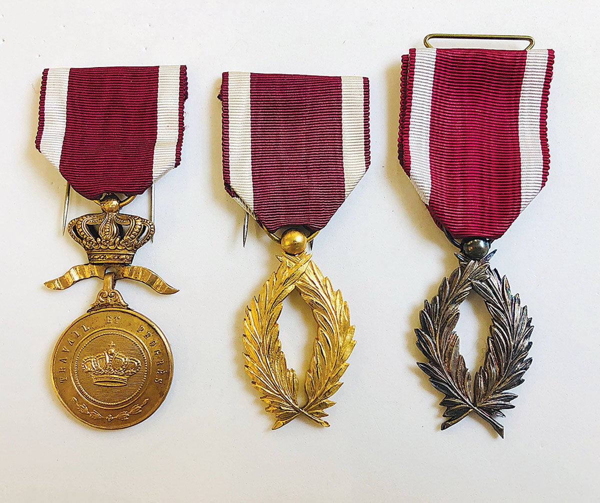 Examples of a gold Order of the Crown Medal and a gold and silver Order of the Crown — part of the sixth class of the order.