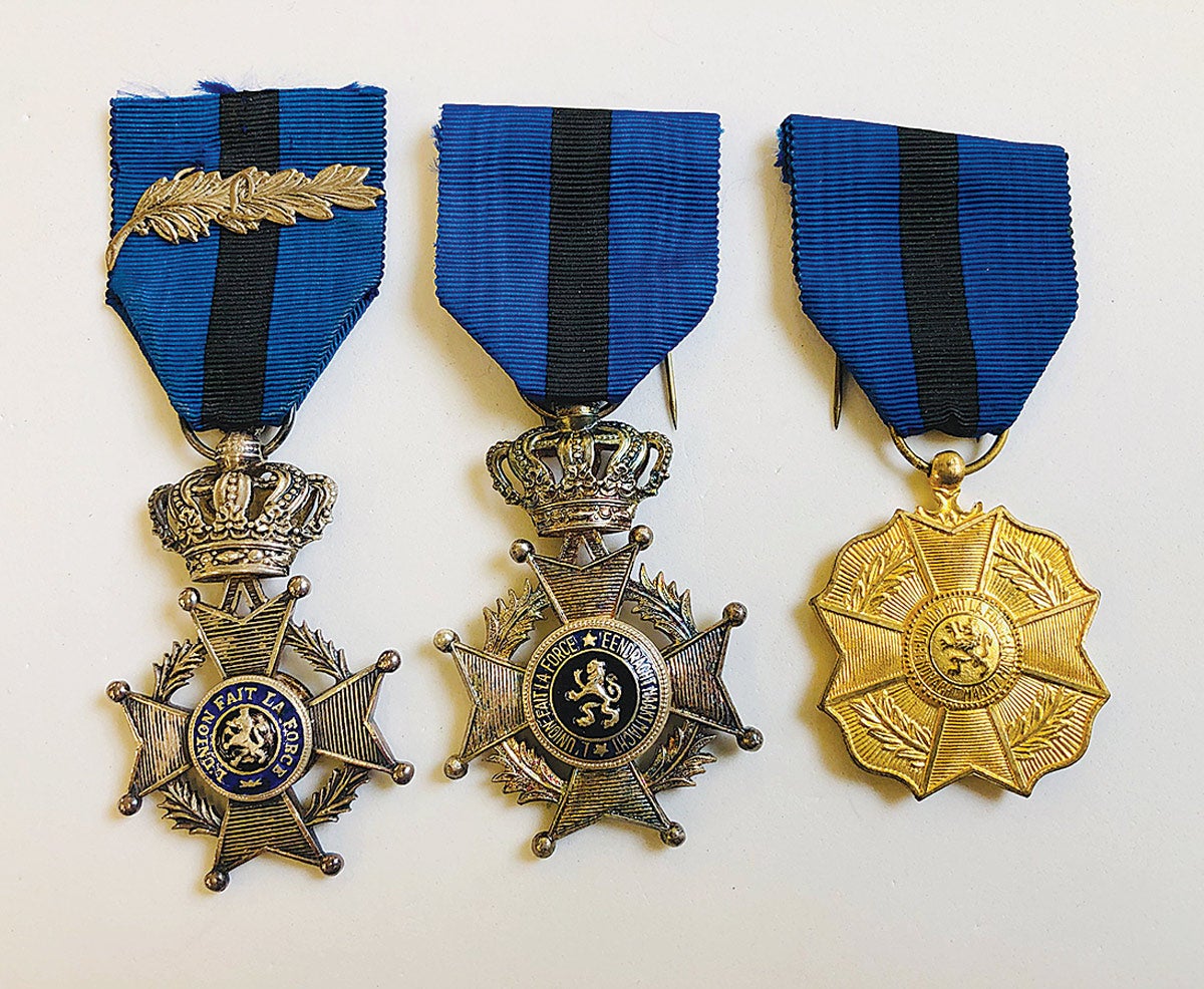The Order of Leopold II knight with silver palm for war action, Order of Leopold II knight, and Order of Leopold II gold medal (1900-1908).