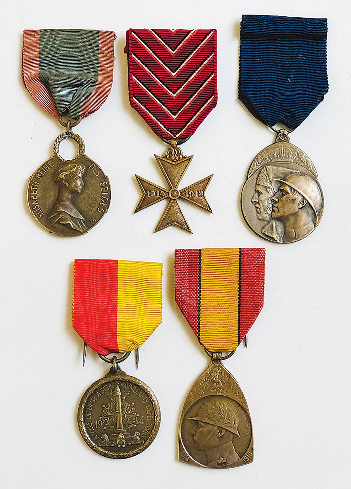 Queen Elizabeth Medal, Cross for the Deported, Volunteer Combatant’s Medal. Bottom row (L-R) Liege Medal, Commemorative Medal WWI.
