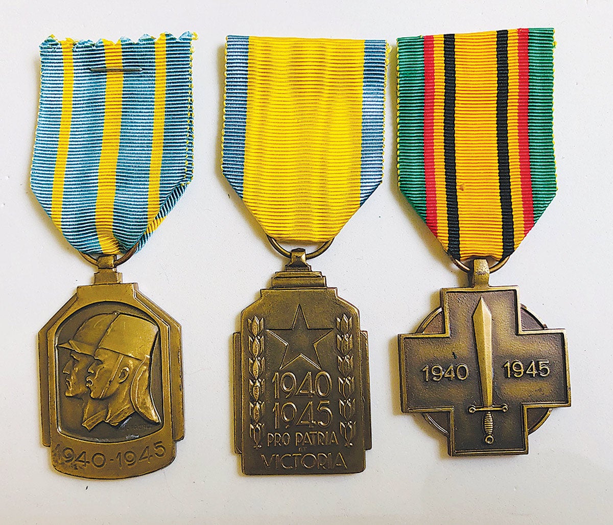 Three uniquely designed Belgium Medals: (L-R) the African War Medal, the Colonial War Effort Medal and the Belgium Medal of the Military, Fighter of the War.
