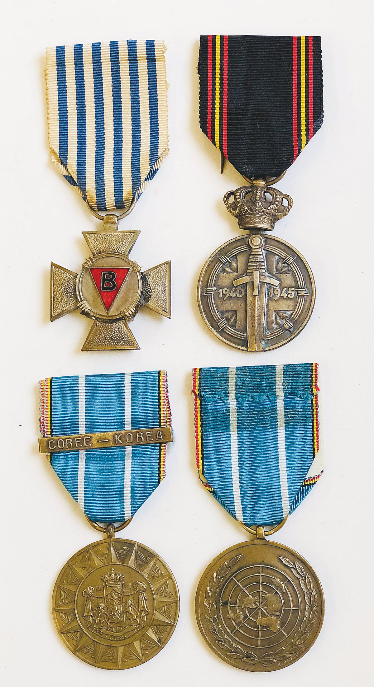 Top row (L-R): Political Prisoner’s Coss and the Prisoner of War Medal. Bottom row (L-R): Belgium Commemorative Medal for Foreign Operations (obverse) and the same medal’s reverse.